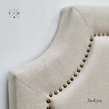 Zoomed-in view focusing on the embedded stud trim detail that adds sophistication to the headboard