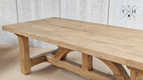 Close-up of the wood grain at the table’s corner, showcasing natural beauty.