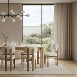 A close view detailed angled image of the styled Hartford Dining Table, and Stuttgart upholstered dining chairs.