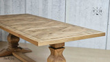 Full length view of the 245cm Darcy Oak Table, emphasizing its size and elegance