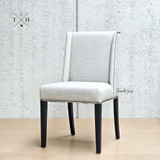 Angle view showcasing the chair’s winged back design, ideal for a comfortable dining experience.