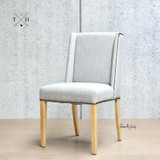 Angle view showcasing the chair’s winged back design, ideal for a comfortable dining experience.