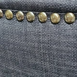 Close-up view focusing on the elegant curve of the chair’s backrest, designed for comfort and support
