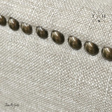 Detailed close-up of the chair's backrest, highlighting the traditional button tufting that adds classic charm