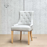 Profile view of the Braddock Chair against a plain background, highlighting its shape and design features