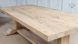 An angular shot focusing on the corners of the Charlested Oak Dining Table, displaying its robust construction