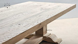 The Charlested Oak Dining Table bathed in natural light, emphasizing its warm oak tones and unapologetic beauty