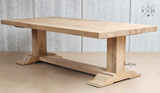 An image capturing the natural wood patterns and grain of the Charlested Oak Dining Table, showcasing its organic beauty