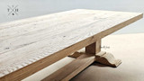 The Charlested Oak Dining Table under muted lighting, accentuating the subtleties of the oak's grain and color