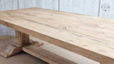 Side view of the Charlested Oak Dining Table, highlighting the thickness and durability of its oak construction