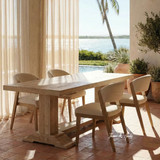 Styled angled image of the Charlested Oak Dining Table in a contemporary ocean front home