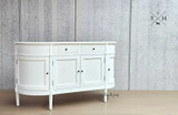 Angled view of the Louis Petite Sideboard, giving a comprehensive look at its design