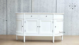 Angled full-length view of the Louis Buffet Petite, giving a comprehensive look at its design