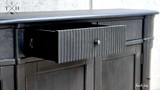 Inside view of an open drawer in the Louis Petite Buffet with metal runner, showcasing its spaciousness and build quality