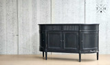 Side profile image of the Louis Buffet Petite, illustrating its depth and clean lines.