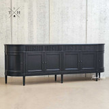The Louis Curved Buffet’s grooved detailing captured in natural light, enhancing its texture