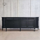 Frontal perspective of the Louis Curved Buffet focusing on the symmetrical arrangement of its grooved drawers, paired with the sleek, modern handles.