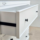 Close-up of the metal drawer runner highlighting the smooth operation and showcasing the hand-carved molding.