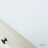 Close-up of the Piastri 3 Drawer chest finish showcasing the white paint stroke patina.