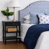 A styled angled view of the Montclair Side Table in Black by Thomas and Hurley.