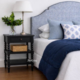 A styled angled view of the Montclair Side Table in Black by Thomas and Hurley.