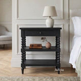Front view of the black Montclair Side Table showing a subtle drawer pull and classic bobbin legs.