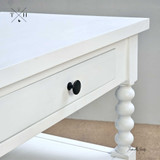 Close up view of the Montclair Side Table showcasing its unique spindle leg features