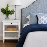 A styled front view of the Montclair Side Table in White by Thomas and Hurley.