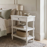 Hamptons style white bedside table with open lower shelving by Thomas and Hurley.