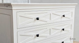 Close-up of the drawer front panel showcasing the geometric patterns.
