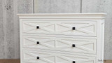 Close-up of the drawer front panel showcasing the geometric patterns.