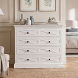 Elegant white storage chest featuring X-pattern drawer fronts.
