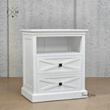 Angled view of the Fremont Bedside Table displaying the unique geometric drawer fronts.