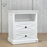 Angled view of the Fremont Bedside Table displaying the unique geometric drawer fronts and timeless design