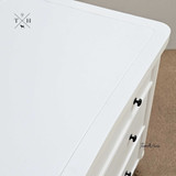 Close-up of the bedside table's surface, highlighting the paint stroke finish and quality craftsmanship
