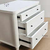 Close-up of open drawers showing the spacious storage area and metal drawer runners.