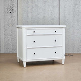 Angled view of Brynmore 3 Drawer Bedside showcasing the three spacious drawers and understated silhouette with curved detailing