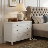 Brynmore 3 Drawer Bedside Table featured in a light-filled bedroom, offering stylish bedside storage with a classic chalk white finish.