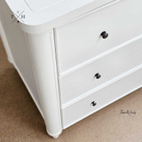 Close-up of the Brynmore 3 Drawer chest finish showcasing the white paint stroke patina.