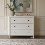White Brynmore 3 Drawer Chest by Thomas and Hurley styled with a neutral vase and abstract artwork.