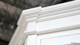 Detailed view of the crown moulding, adding a refined touch to the cabinet’s design.