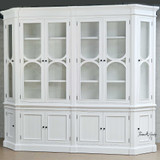 Angled view of the cabinet, highlighting the intricate moulding and angled design.