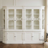 Zoomed in Front view of the Stonefield Double Display Cabinet Wall Unit with Angled Sides in situ in a living room
