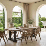 The Parkhouse Double Pedestal Dining Table effortlessly extends indoor style to covered outdoor entertaining spaces. The handcrafted oak finish and distressed grey base create a relaxed Mediterranean-inspired setting for long lunches