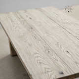 Detailed close-up highlighting the exquisite wood grain on the Trailbridge's oak tabletop