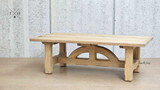 Side view of the table surface, focusing on the texture and finish of the oak.