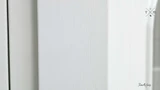 Close-Up of White Paint Finish - A detailed view of the Stonefield Wall Unit’s white paint-stroke patina, showcasing the hand-finished and subtly distressed surface that adds a layer of texture and depth to its classic design.
