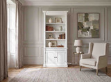 Minimalist white Stonefield single bookcase wall unit in a neutral warm grey living room setting