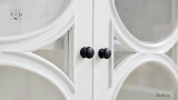 Close-Up of Glass Door Detailing - A close-up angle of the intricately designed glass doors, emphasising the neoclassical-inspired wood detailing and fine craftsmanship.