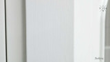 Close-Up of White Paint Finish - A detailed view of the Stonefield Wall Unit’s white paint-stroke patina, showcasing the hand-finished and subtly distressed surface that adds a layer of texture and depth to its classic design.